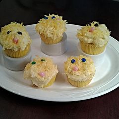 A picture of White Chocolate Cupcakes with White Chocolate Whipped Cream Frosting.