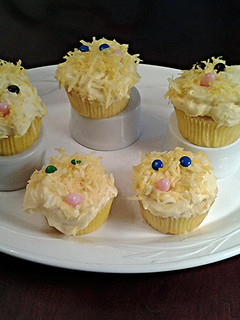 A picture of White Chocolate Cupcakes with White Chocolate Whipped Cream Frosting.