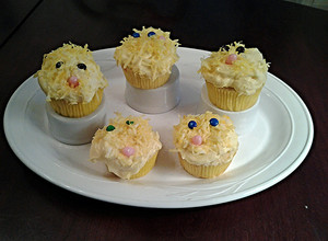 A picture of White Chocolate Cupcakes with White Chocolate Whipped Cream Frosting.