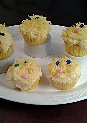 A picture of White Chocolate Cupcakes with White Chocolate Whipped Cream Frosting.