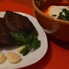 A picture of Rye bread toasts to Ukrainian Borshch.