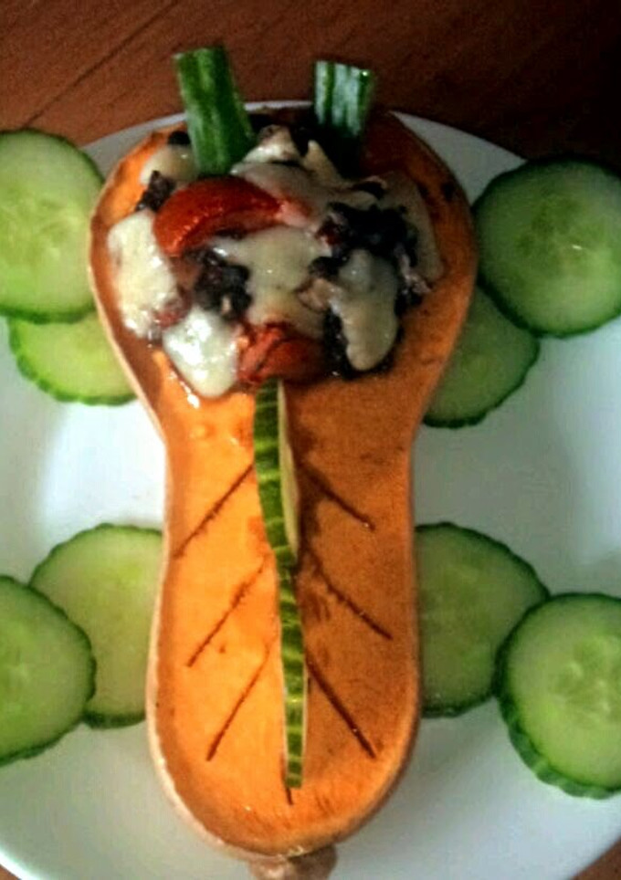 A picture of Sig's Roasted butternut squash filled with garlic mushrooms.