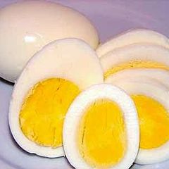 A picture of Hard Boiled Eggs On Gas Stove.