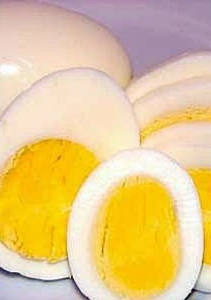 A picture of Hard Boiled Eggs On Gas Stove.