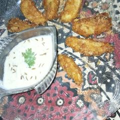 Potato wedges with lays chips coating A picture of Potato wedges with lays chips coating.