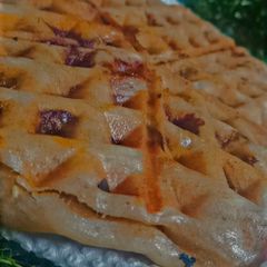 A picture of Pizza inspired stuffed waffle.