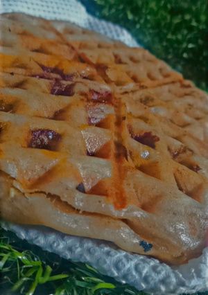 A picture of Pizza inspired stuffed waffle.