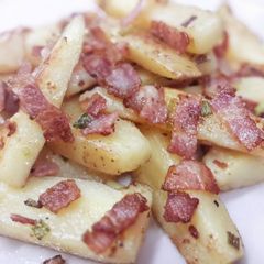 A picture of Bacon roasted potato wedges.