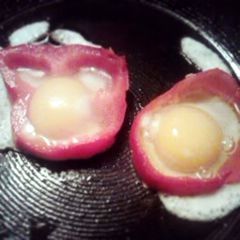 A picture of red bell pepper w/ egg.