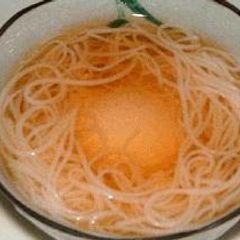 A picture of Somen Noodles with an Poached Egg.