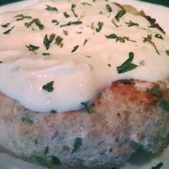 A picture of Greek Turkey Burgers with Avocado and a Lemon Parsley Mayo.