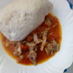 A picture of Ugali and meat stew.