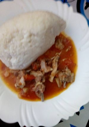 A picture of Ugali and meat stew.