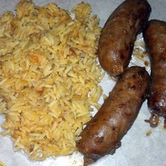 A picture of turkey sausage with rice.