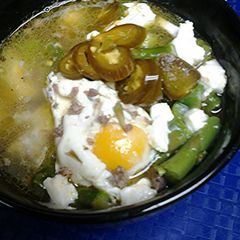 A picture of Sausage, asparagus, and egg soup.