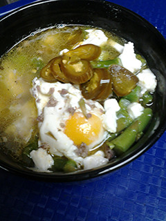 A picture of Sausage, asparagus, and egg soup.