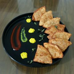 A picture of Punjabi samosa from leftover rice.