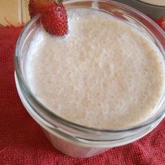 A picture of Milk shake with leftover cake crumbs.