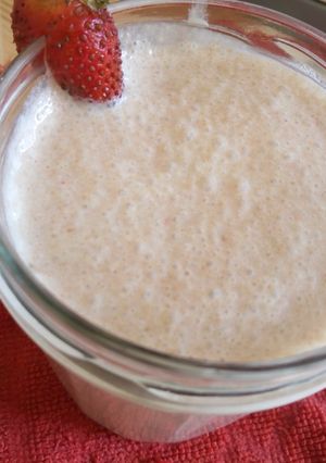 A picture of Milk shake with leftover cake crumbs.