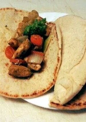 A picture of Curry Chicken Pitas.