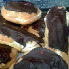 A picture of Cream puffs or chocolate eclairs.