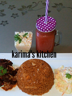 A picture of Jollof rice/peppered beef and coleslaw.