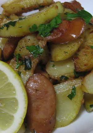 A picture of Potatoes and Sausages with Herb Lemon Butter.