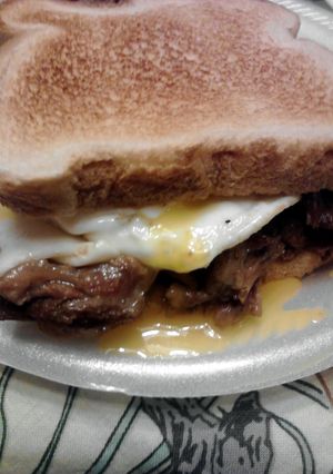 A picture of Eggs over Pot Roast on Toast.