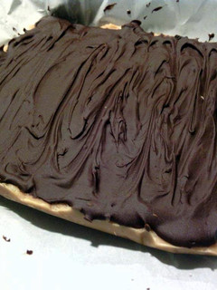 A picture of chocolate covered peanut butter fudge.
