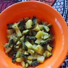A picture of Bitter Gourd Green Mango Curry.