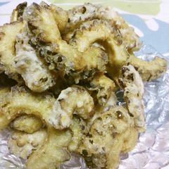 A picture of Deep-Fried Bitter Melon Seasoned with Garlic & Cheese.