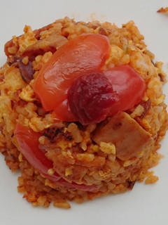 A picture of Sriracha Tomato Spam And Onion Fried Rice.