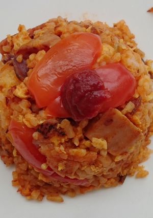 A picture of Sriracha Tomato Spam And Onion Fried Rice.