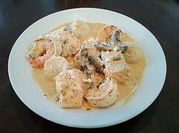 A picture of cream scallops and shrimp