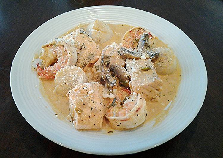 Simple Way to Prepare Homemade Salmon, Shrimp and Scallops poached in a Tomato Cream Broth