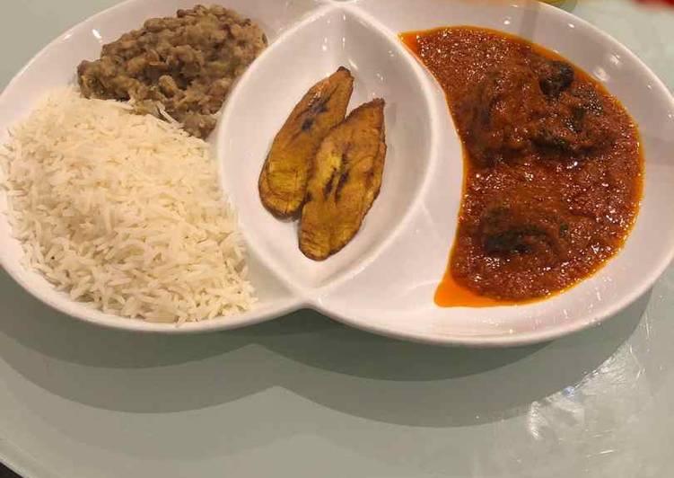 Rice and beans with plantain and stew