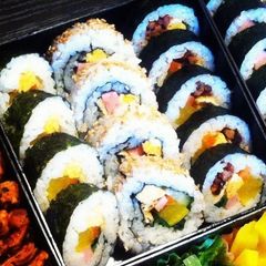 A picture of 3 Different Kimbaps (Korean Seaweed Rolls).