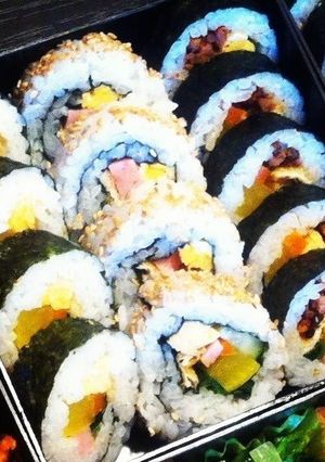 A picture of 3 Different Kimbaps (Korean Seaweed Rolls).