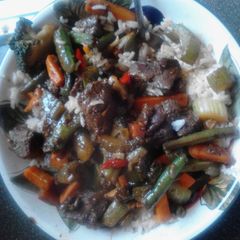 A picture of Beef stir fry w rice.