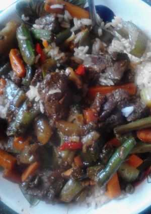 A picture of Beef stir fry w rice.