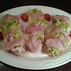 A picture of Crab Salad with Ham Crostini.