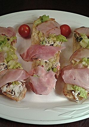 A picture of Crab Salad with Ham Crostini.