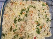 A picture of chicken fried rice with vegetables