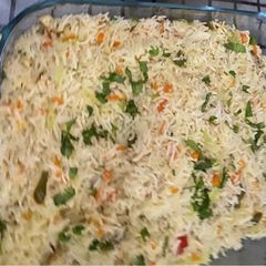 A picture of Chicken and vegetable fried rice.