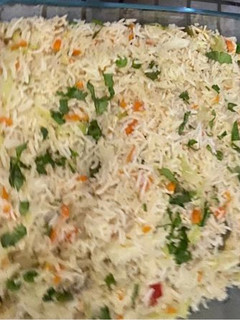 A picture of Chicken and vegetable fried rice.