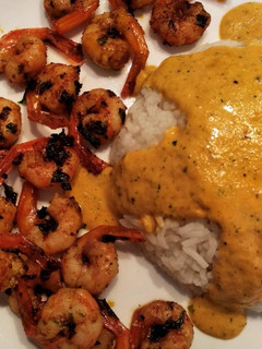 Una foto de Arroz al curry con gambas