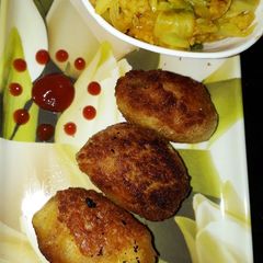 A picture of Crispy Vegetable khichdi bonda.