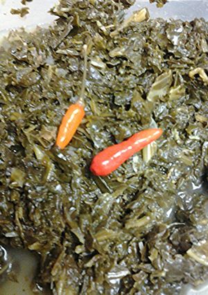 A picture of Kale spinach and onions.