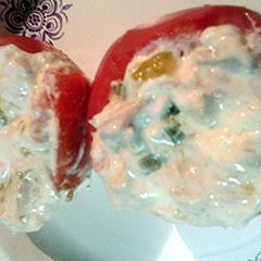 A picture of Tuna salad stuffed tomatoes.