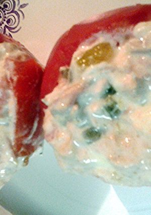 A picture of Tuna salad stuffed tomatoes.